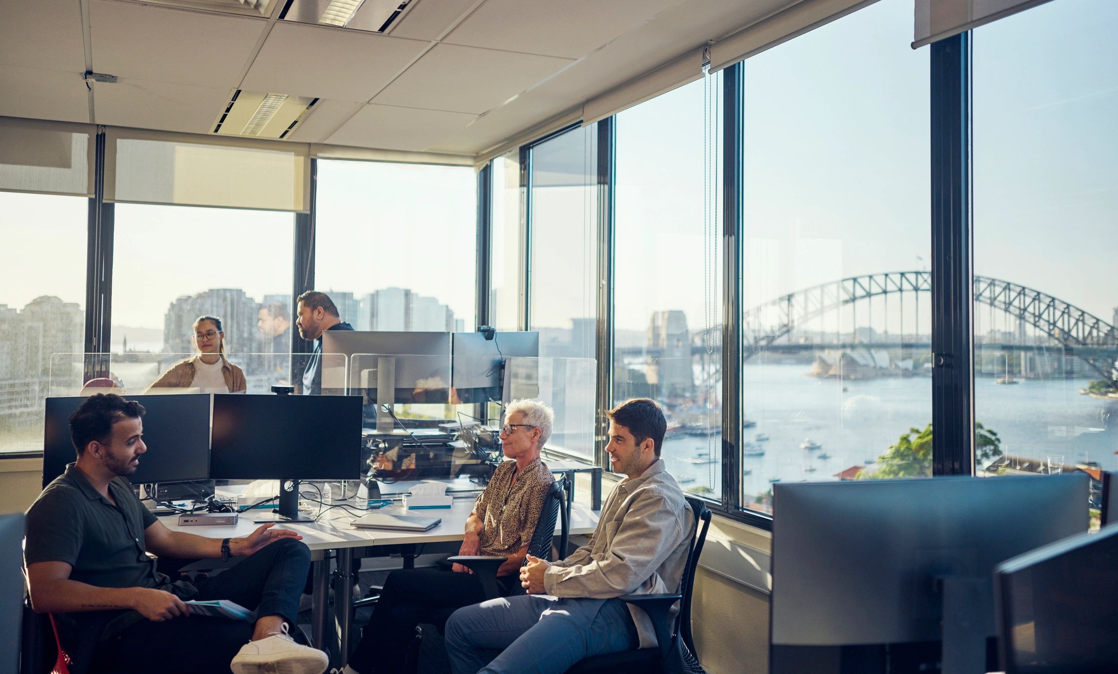 Operations team collaborating in a software office